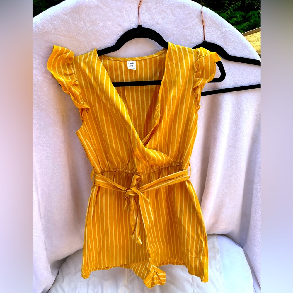 Girls Golden Yellow romper with ruffled sleeves. Size 12-13